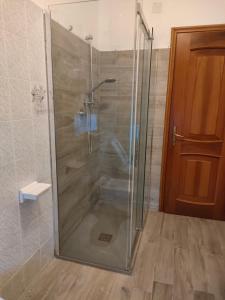 a shower with a glass door in a bathroom at casa vacanze relais in Fara San Martino