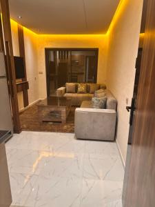 a living room with a couch and a table at Taghrid 3 in Kenitra