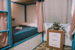 Postel nebo postele na pokoji v ubytování Kite & Surf Nomad House