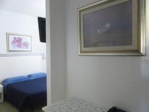 Postel nebo postele na pokoji v ubytování Hotel Galassi