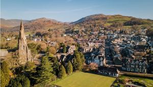 an aerial view of a small town with a church at Hideaway Suite in Ambleside