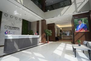 a lobby with a picture of a man on the wall at CONTINENTAL DARVOZ Hotel in Dashtak