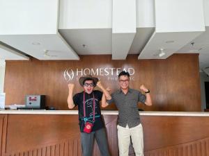 two men are standing in front of a counter at Homestead Seaview Phu Quoc Hotel in Phu Quoc +47 photos
