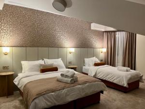 Postel nebo postele na pokoji v ubytování Saffron Boutique Hotel