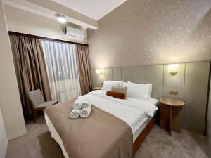 Postel nebo postele na pokoji v ubytování Saffron Boutique Hotel