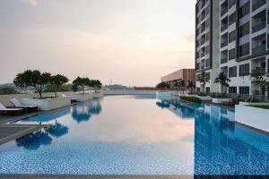 a large swimming pool in the middle of a building at LOVINA 17-11 at Harbour Bay Residences in Nagoya