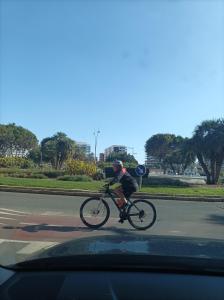 un hombre montando una bicicleta por una calle en Casa Tejar, en Almería 1 foto más