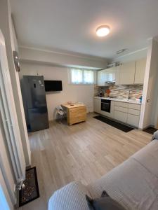 a room with a kitchen and a living room at Casa Angelina -Humanitas- Forum Assago-private Parking in Rozzano