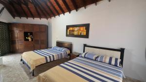 Cama o camas de una habitación en Chalet Real