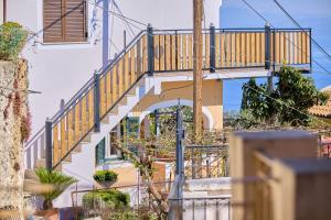 a staircase leading up to a building at Christine's Seaview by CorfuEscapes in Spartýlas