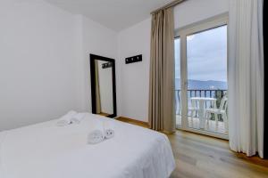 Postel nebo postele na pokoji v ubytování Hotel Bellavista
