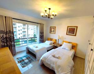 Postel nebo postele na pokoji v ubytování Discover your New Escape