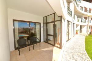 a person sitting at a table in a building at Bay in São Martinho do Porto +23 photos
