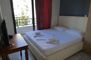 Postel nebo postele na pokoji v ubytování Privé City Hotel