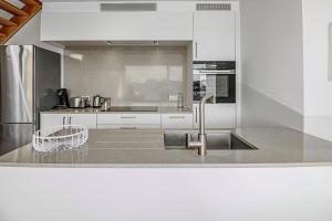 a kitchen with a sink and a counter top at Villa Zephir O3O5G 221 in Nieuwpoort