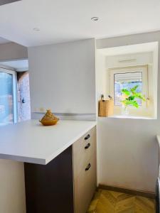 Kuchyň nebo kuchyňský kout v ubytování La maison du Cordonnier + 17 fotografií