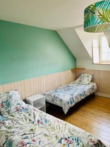 Postel nebo postele na pokoji v ubytování La maison du Cordonnier