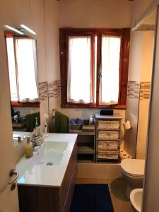 a bathroom with a sink and a toilet at Casa Marzia in Montevarchi +41 photos