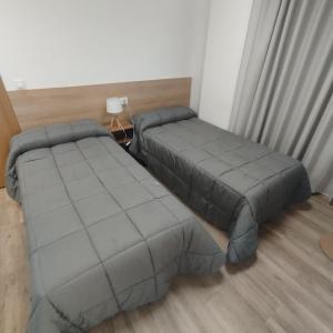 dpaso Urban Hostel客房内的一张或多张床位