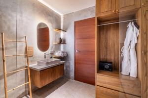 a bathroom with a sink and a mirror at Arusa Home Bali - Luxury Private Suites Canggu in Canggu +121 photos