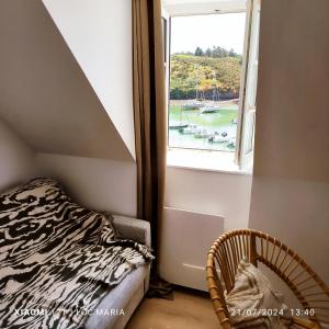 Postel nebo postele na pokoji v ubytování Le Roi de Guerveur - Appartement vue mer