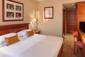 Letto o letti in una camera di Starhotels Michelangelo Rome