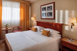 Letto o letti in una camera di Starhotels Michelangelo Rome