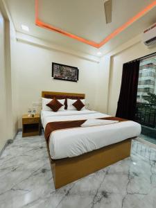 Hotel Fun Suite- Baner Hill客房内的一张或多张床位
