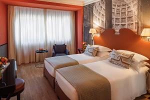 Letto o letti in una camera di Starhotels Michelangelo Rome