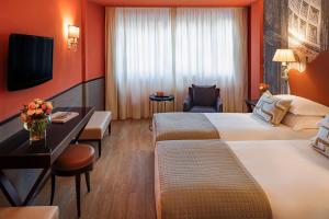 Letto o letti in una camera di Starhotels Michelangelo Rome