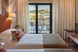 Letto o letti in una camera di Starhotels Michelangelo Rome
