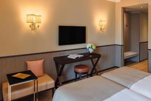 TV o dispositivi per l'intrattenimento presso Starhotels Michelangelo Rome
