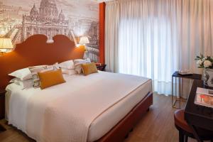 Letto o letti in una camera di Starhotels Michelangelo Rome