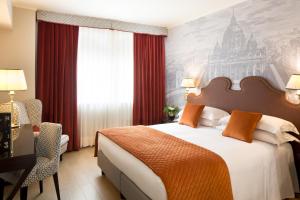 Letto o letti in una camera di Starhotels Michelangelo Rome