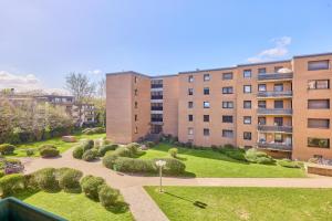 a garden in front of an apartment building at Ida, the suburban apartment nearby Cologne in Bergheim