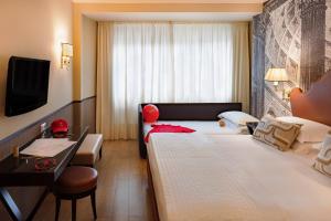 Letto o letti in una camera di Starhotels Michelangelo Rome