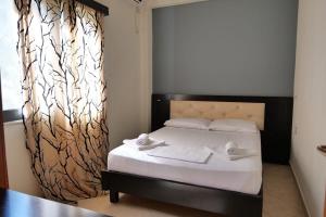 Postel nebo postele na pokoji v ubytování Privé City Hotel