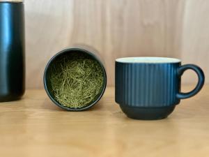 two cups of green tea sitting on a table at Vanderkamp in Cleveland