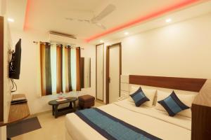Postel nebo postele na pokoji v ubytování Hotel Airport Paradise At Delhi Airport