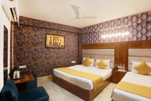 Postel nebo postele na pokoji v ubytování Hotel Airport Paradise At Delhi Airport