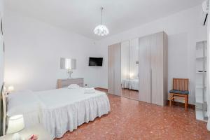 Ένα ή περισσότερα κρεβάτια σε δωμάτιο στο Appartamento Roma - La Casetta di Vale