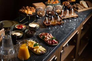 a buffet with many plates of food on a table at The K Nest Hotel Nafplio in Nafplio