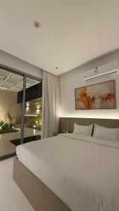 Ένα ή περισσότερα κρεβάτια σε δωμάτιο στο منتجع عسيب نجد