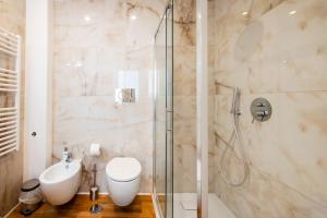 a bathroom with a shower and a toilet and a sink at Casanuova in Rome +31 photos
