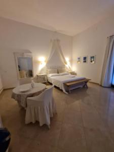 Voodi või voodid majutusasutuse Bianca Suite Polignano toas