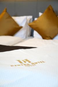 Postel nebo postele na pokoji v ubytování Centra Hotel Winterthur