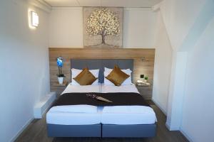 Postel nebo postele na pokoji v ubytování Centra Hotel Winterthur