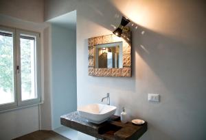 a bathroom with a sink and a mirror at Azienda Agricola Baccagnano in Brisighella