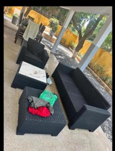 an overhead view of two black chairs and a table at Villa mango in Somone