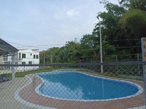 a swimming pool with a fence around it at Casa N4 in Carmen de Apicalá